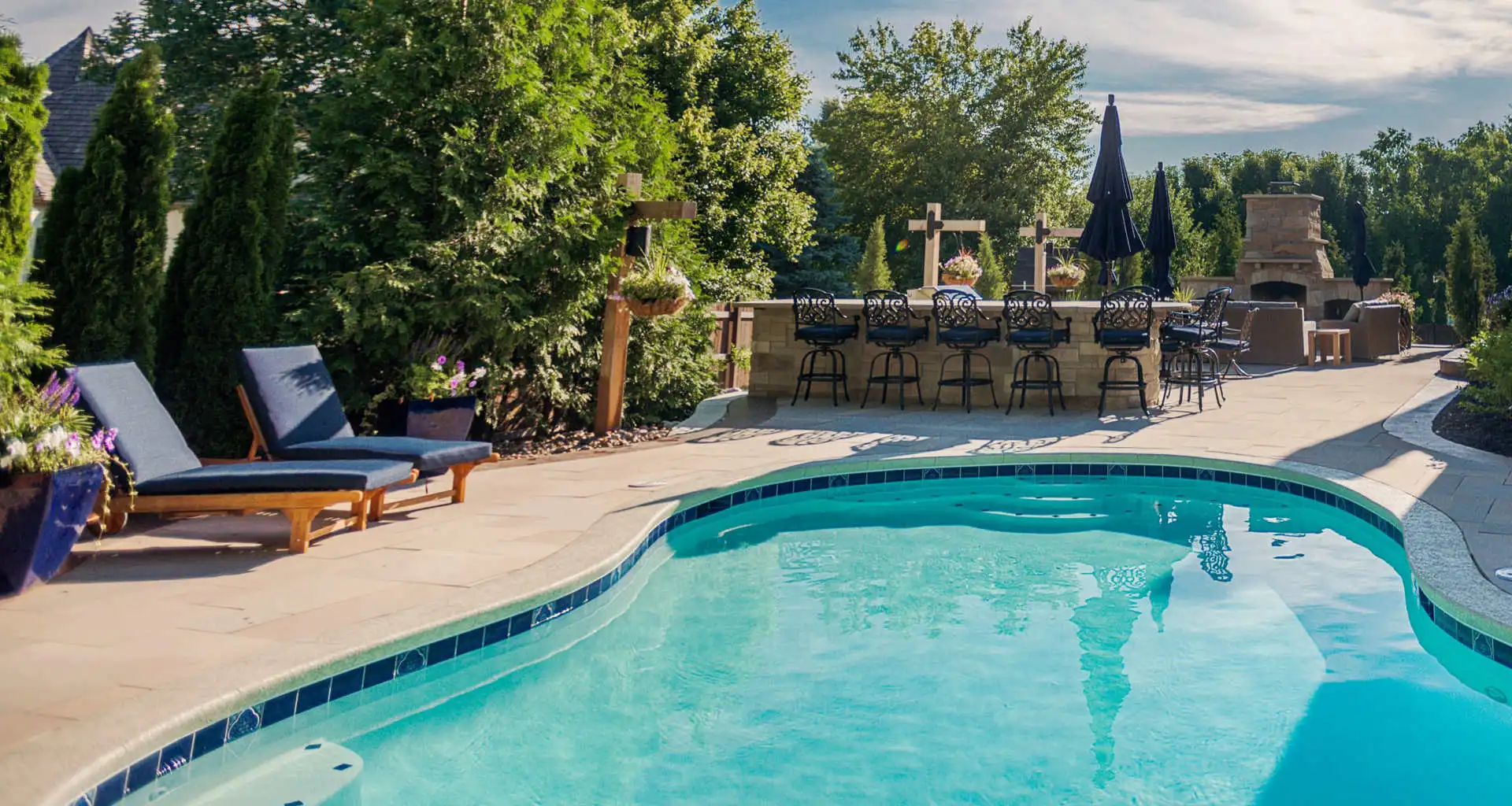New pool, outdoor kitchen and fireplace installed in Overland Park, KS.