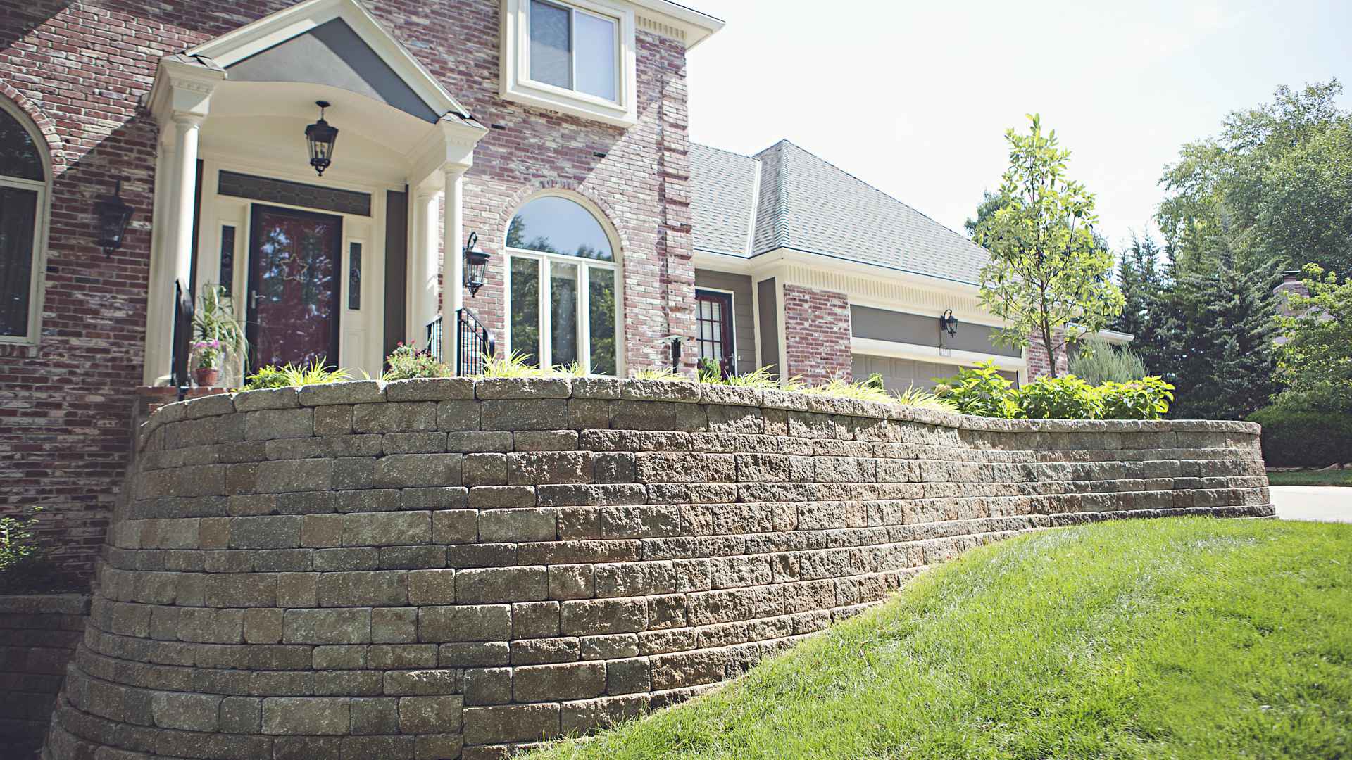 Retaining wall at the entrance of a beautiful home.