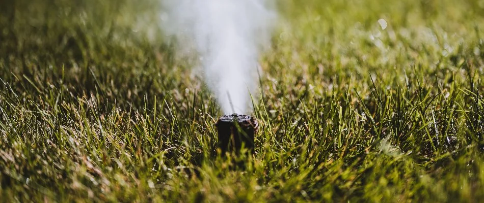 Blowing water out of an irrigation sprinkler head in Overland Park, KS.