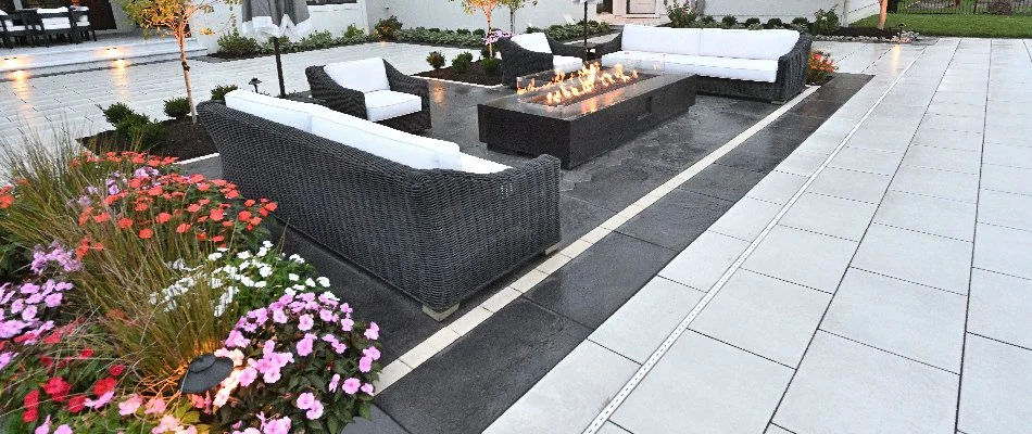 Paver patio in Overland Park, KS, with a fire pit and seating.
