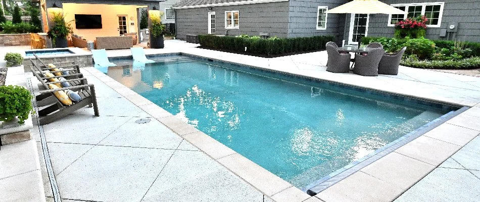 Pool in Overland Park, KS, with a sun shelf.