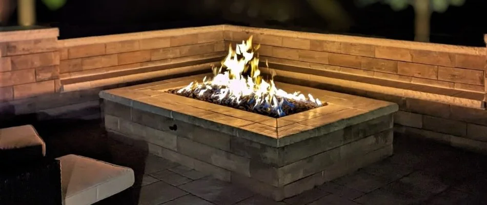 Seating wall around a gas fire pit in Overland Park, KS.