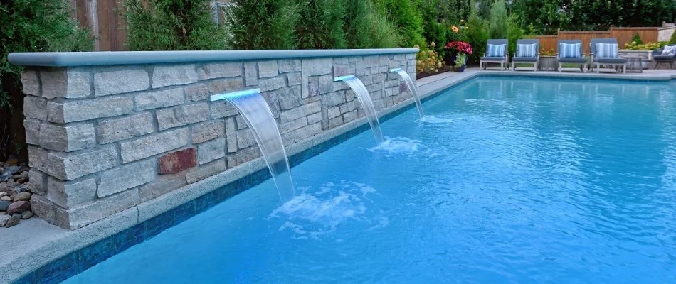 Stone waterfall for a swimming pool in Overland Park, KS.