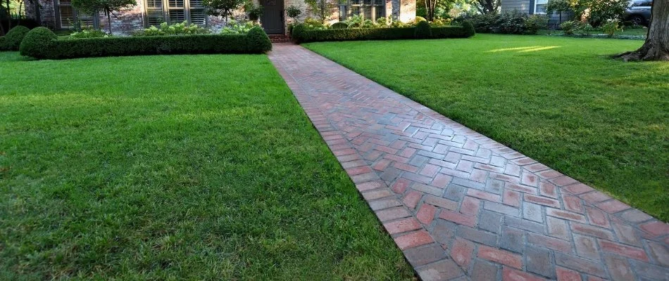 Brick walkway on a lawn in Overland Park, KS.