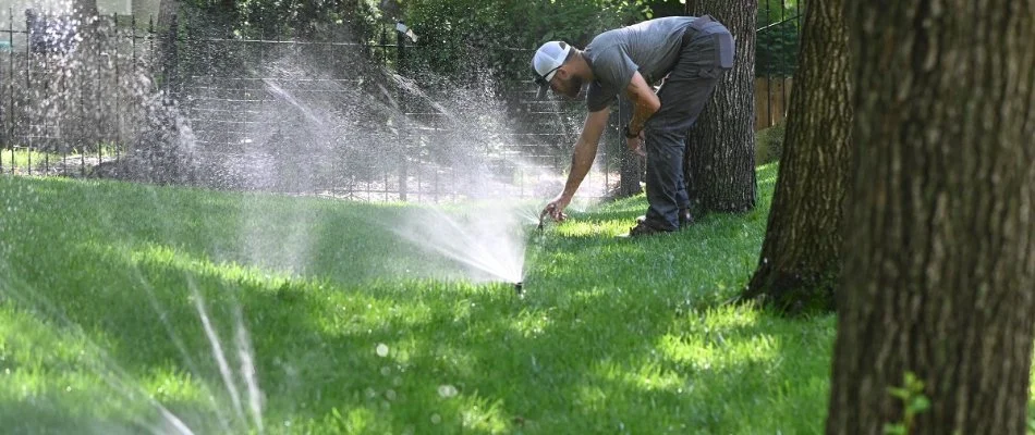 Crew member checking an irrigation system in Overland Park, KS.