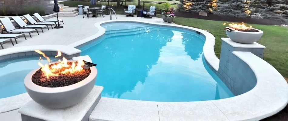 Fire features around a pool in Lake Quivira, KS.