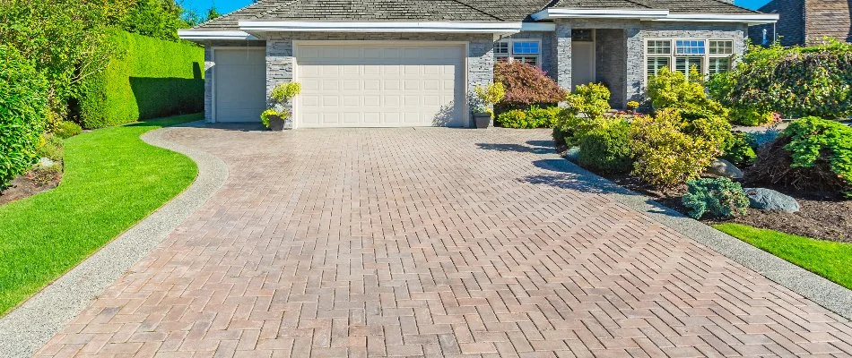 House in Overland Park, KS, with a paver driveway and landscaping.