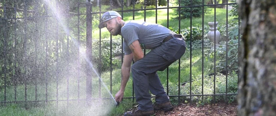 Irrigation sprinkler head adjustment in Loch Lloyd, MO, by a professional.