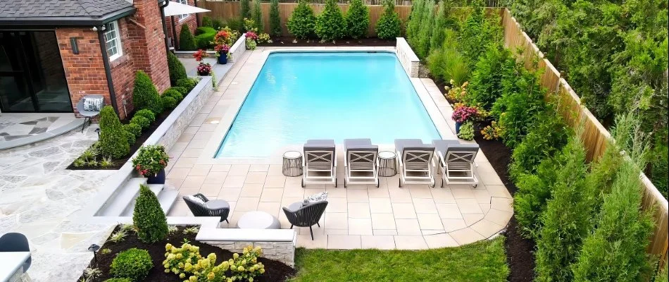 Landscaping around a pool deck in Fairway, KS.