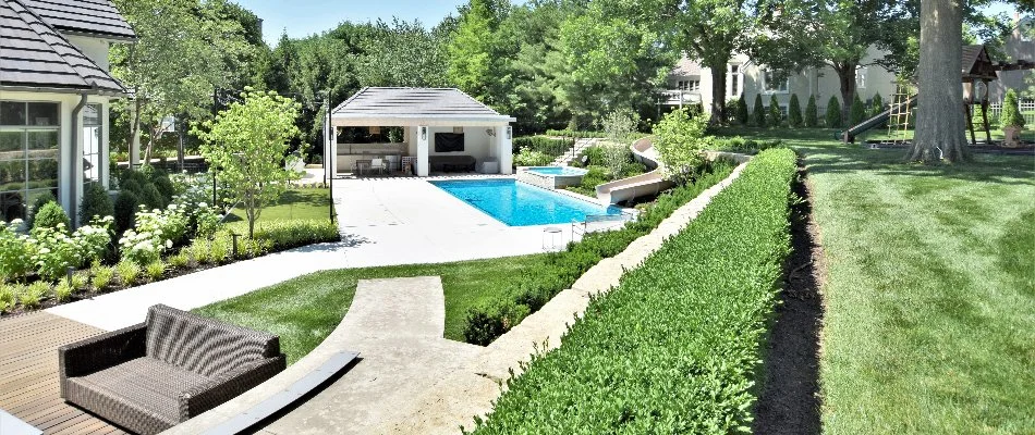 Landscaping near a swimming pool in Greenwood, MO.
