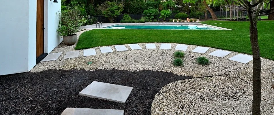 Landscaping and walkway near pool in Leawood, KS.