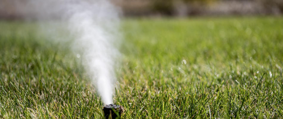 Irrigation winterization process in progress by blowing out the water in the lines.