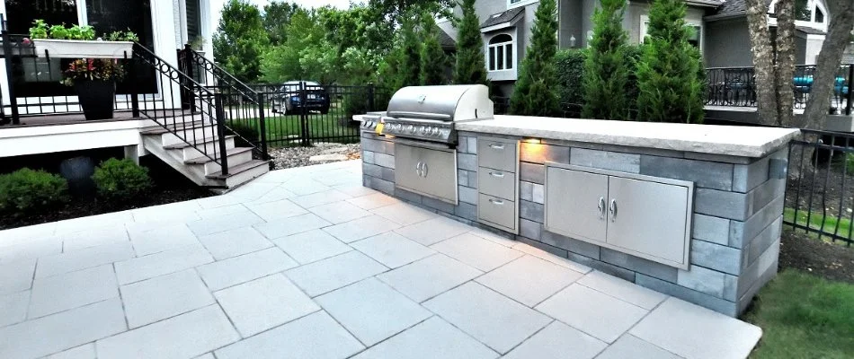 Outdoor kitchen with grill on a property in Overland Park, KS.