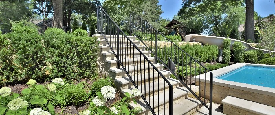 Outdoor steps with black railings on a property in Overland Park, KS.