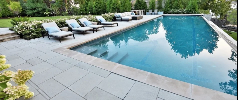 Swimming pool in Overland Park, KS, with a paver patio and seating.