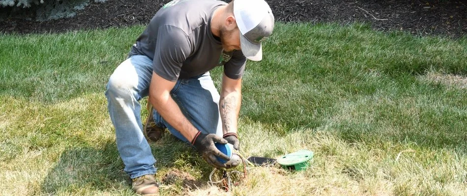 Worker repairing an irrigation system in Mission, KS.